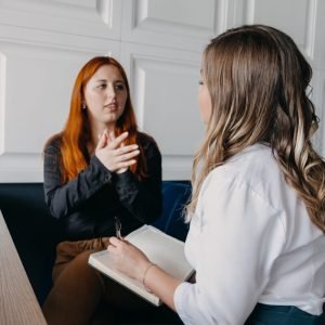 Woman talking with a counselor during grief therapy in Wilmington NC