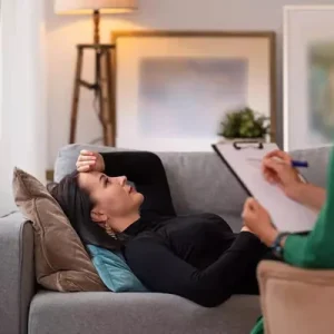 Person processing past experiences during trauma therapy in Wilmington