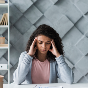 Woman feeling overwhelmed by stress before a counseling session in Wilmington NC